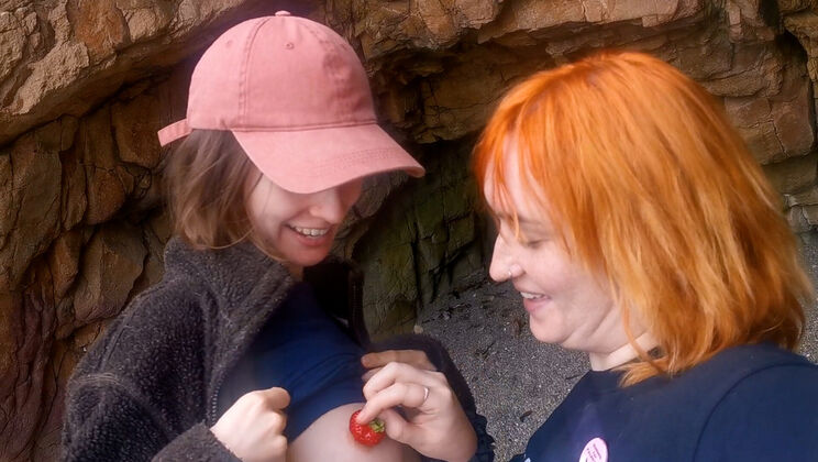 Redhead and Brown Hair Girls Spit on Beach